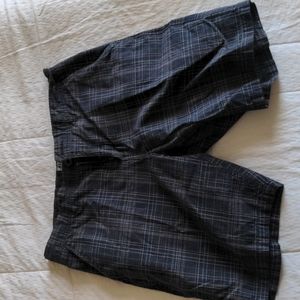 Men's shorts. Dress or casual. Black with colors. Size 31. Great condition.